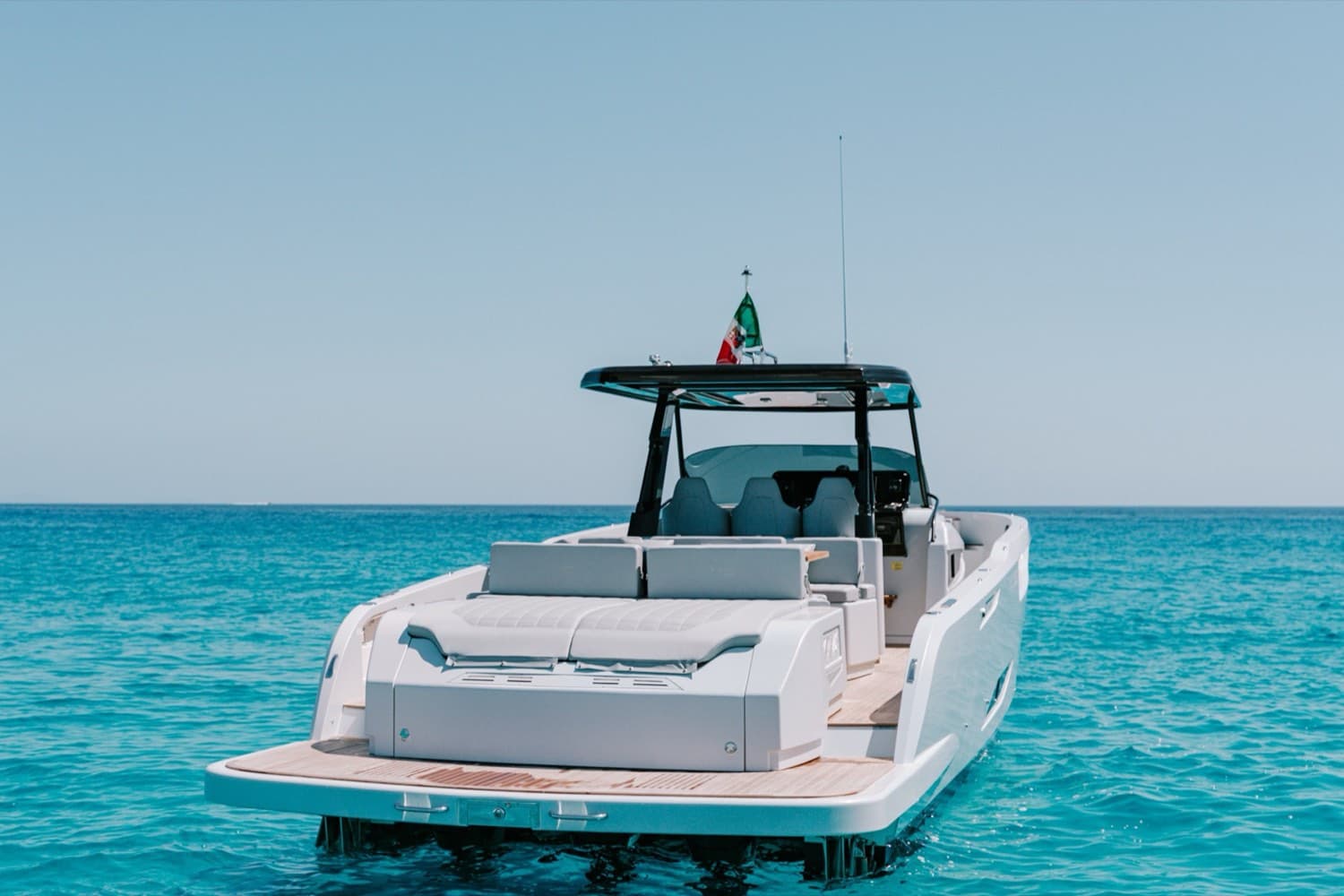 Crystal-clear cove on Ibiza's coast reached by yacht tender